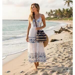 Brighton Sierra straw hobo bag in navy blue and natural  with leather trim.